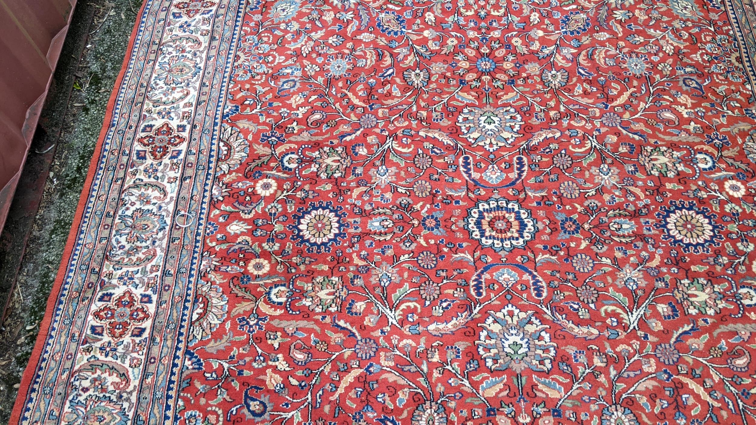 Persian hand woven rug having a red ground with a floral design multiguard borders and tasselled - Image 4 of 8