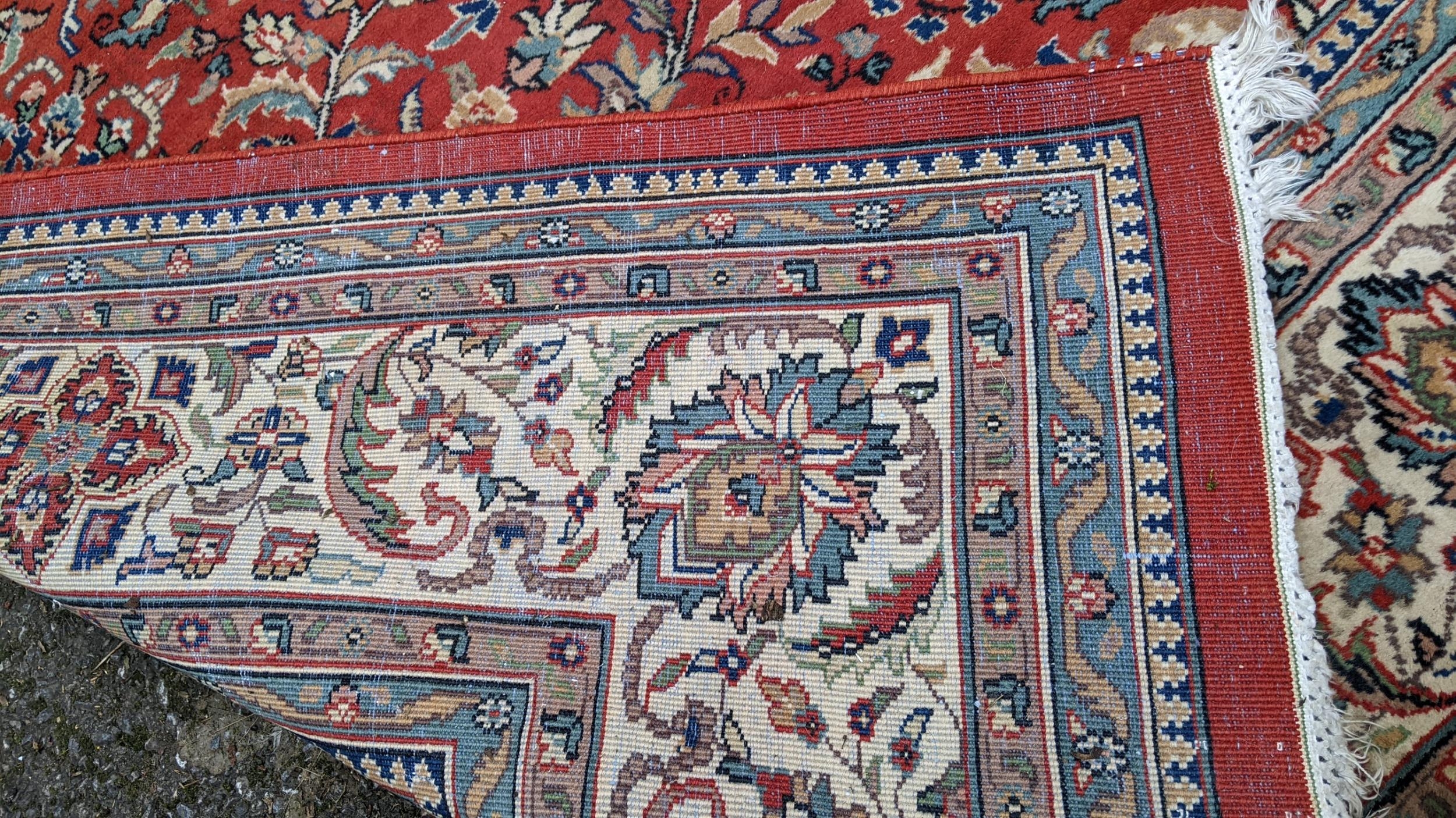 Persian hand woven rug having a red ground with a floral design multiguard borders and tasselled - Image 8 of 8