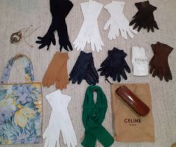 A quantity of vintage accessories comprising ladies gloves, a green belt, a Celine dustbag, a fabric