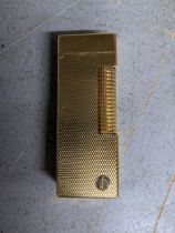 A Dunhill gold plated cigarette lighter Location: