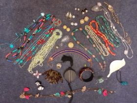 A quantity of costume jewellery, mainly bead necklaces to include an Egyptian style leather and bead