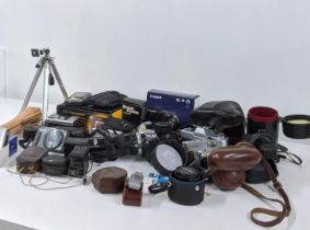 A collection of photographic equipment to include a Canon SX610HS, Minolta SRT101 and others