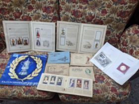 A lot of cigarette cards mounted in albums, a Post office commemorative coins and stamp set to