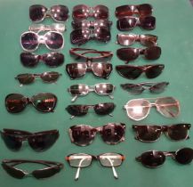 A large quantity of 1970's to modern day sunglasses and prescription examples to include Police,