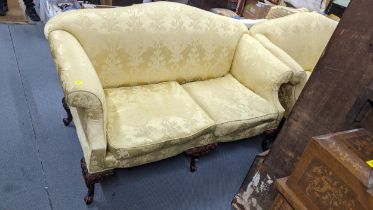 A pair of Victorian style sofas having yellow upholstery and an mahogany cabriole legs 98h175wx83d