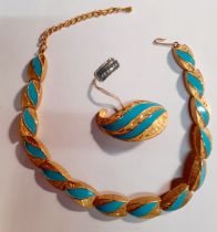 A vintage Kramer gold tone and turquoise enamelled necklace and matching boteh shaped brooch.