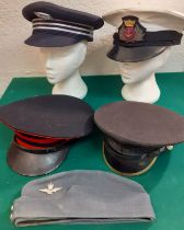 A collection of 5 services hats to include a London Underground peaked cap, a Royal UK Merchant Navy