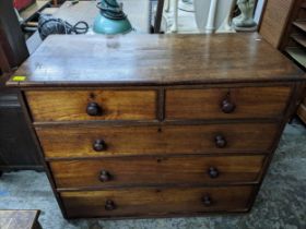 A Victorian mahogany flat fronted chest of two short and three graduated drawers with bun handles