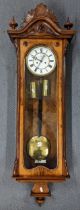 A late Victorian walnut veneered 8-day Vienna wall clock 120cm x 38.5cm Location: