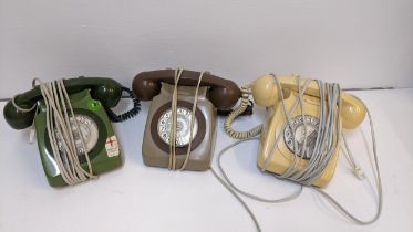 Three vintage telephones in green, cream and brown Location: