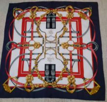 Hermes- A silk Grand Menage scarf designed by Henry d'Origny having a white ground with red, pink,