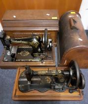 Two vintage Singer sewing machines comprising a 1908 model in an oak case serial no:V125208 and a