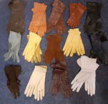A quantity of vintage ladies gloves, an Art Deco cream satin wedding dress A/F (some stains) with