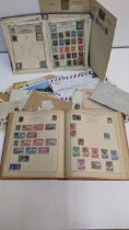 World postage stamps from the early 20th century and later contained in albums and loose to