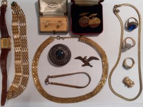 A quantity of costume jewellery and a Coca Cola watch to include a pair of Churchill's club gold