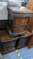 Three reproduction mahogany bow fronted two drawer bedside chests Location: