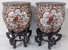A pair of 20th century Chinese Macau porcelain fish bowl, 30.5cm h x 320cm w, raised on treen stands