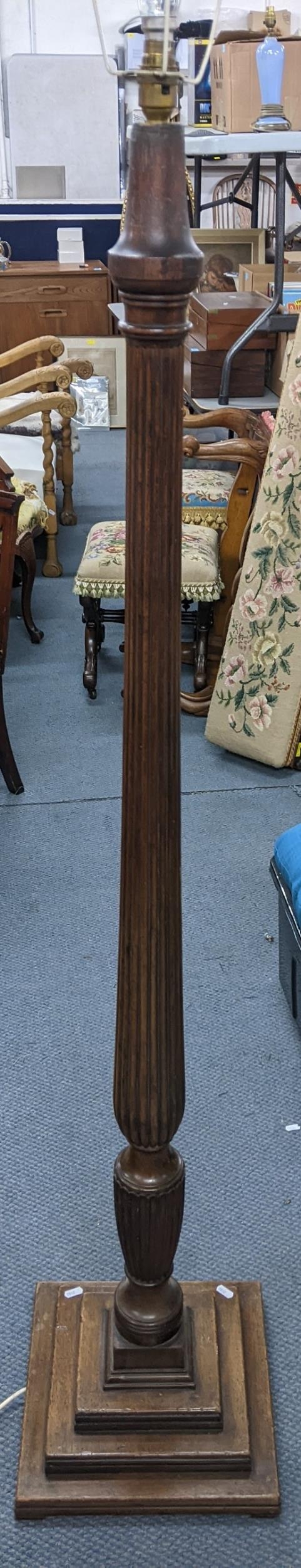 A Victorian mahogany 'bedpost' standard lamp having a reeded column and a stepped base Location: