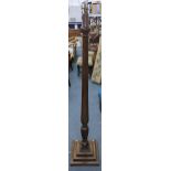A Victorian mahogany 'bedpost' standard lamp having a reeded column and a stepped base Location: