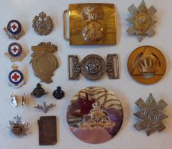 A quantity of military and other badges and buckles to include a 6th West York Militia Officer's