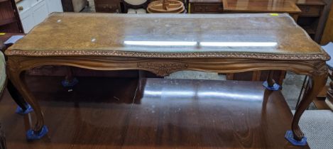 A Walnut long John coffee table with burr walnut and inset glass top floral knee carved cabriole