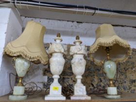 A pair of mid century carved alabaster table lamps, and a pair of green onyx and gilt metal table