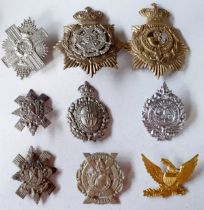 Three Victorian Military interest helmet plates and belt badge including The Border Regiment