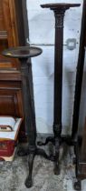 A carved mahogany torchere stand, circular top with shaped moulded edge rim, carved leaf and