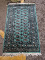 A Persian style machine made rug of symmetrical design with twenty two central gulls, an abstract