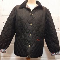 Barbour- A ladies navy Windlass quilted jacket with navy corduroy collar having an abstract floral