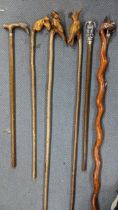 Six walking sticks, the handles fashioned as animals, to include birds, fox and a horse Location: