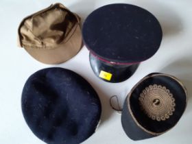 A group of 4 hats to include a navy felt Royal Regiment of Wales cap size 6⅞, a brown USSR army