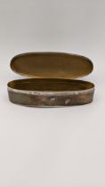 A silver oval shaped trinket box having a hinged lid hallmarked London 1913 total weight 100.1g