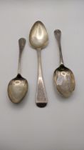 Three silver spoons to include a tablespoon, hallmarked London 1821 and others, total weight 156.