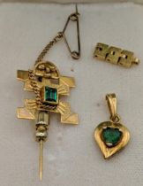 Gold to include a Mexican stick pin stamped 18k and a pendant 4g total Location: