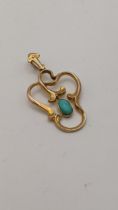 A yellow metal pendant set with a semi precious stone, 2.1g Location: