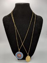 Two 9ct gold necklaces 6g, a Millefiori pendant in a gold clasp and 9ct gold locket 3.4g total