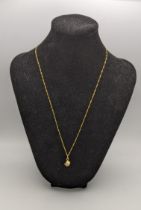 A 9ct gold pendant fashioned as a dice on a 9ct gold necklace 1.8g Location: