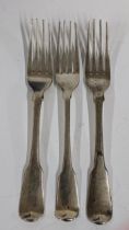 Three Georgian silver table forks to include a pair engraved with a family crest, hallmarked