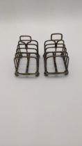 A pair of silver toast racks, hallmarked Sheffield 1905, total weight 91.7g Location:
