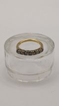 An 18ct gold ring set with seven diamonds Location: