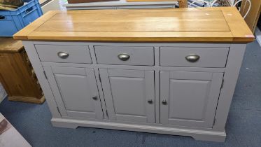 A modern light oak and grey painted sideboard having three drawers above cupboards 84.5hx138w and