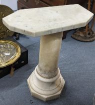 A marble occasional table having a turned column and an octagonal base 63cm h x 52.5cm w Location: