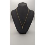 A 18ct gold pendant set with a oval cut sapphire and diamond, on 18ct gold necklace, 3.4g Location: