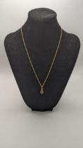 A 18ct gold pendant set with a oval cut sapphire and diamond, on 18ct gold necklace, 3.4g Location:
