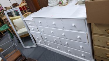 Mixed white painted modern furniture to include three chests of drawers and a mirror Location: