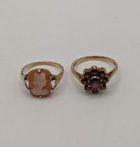 A 9ct gold ring set with red garnets fashioned as a flower 3g along with a yellow metal cameo