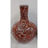 A large modern Chinese bulbous vase decorated with dragons with a band of ruyi head border to the