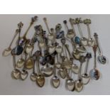 A selection of Continental silver and enamelled collector's spoons to include silver plated examples