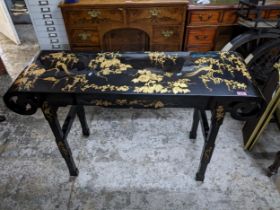 A contemporary Oriental black lacquered and giltwork hall table, birds and butterflies amongst